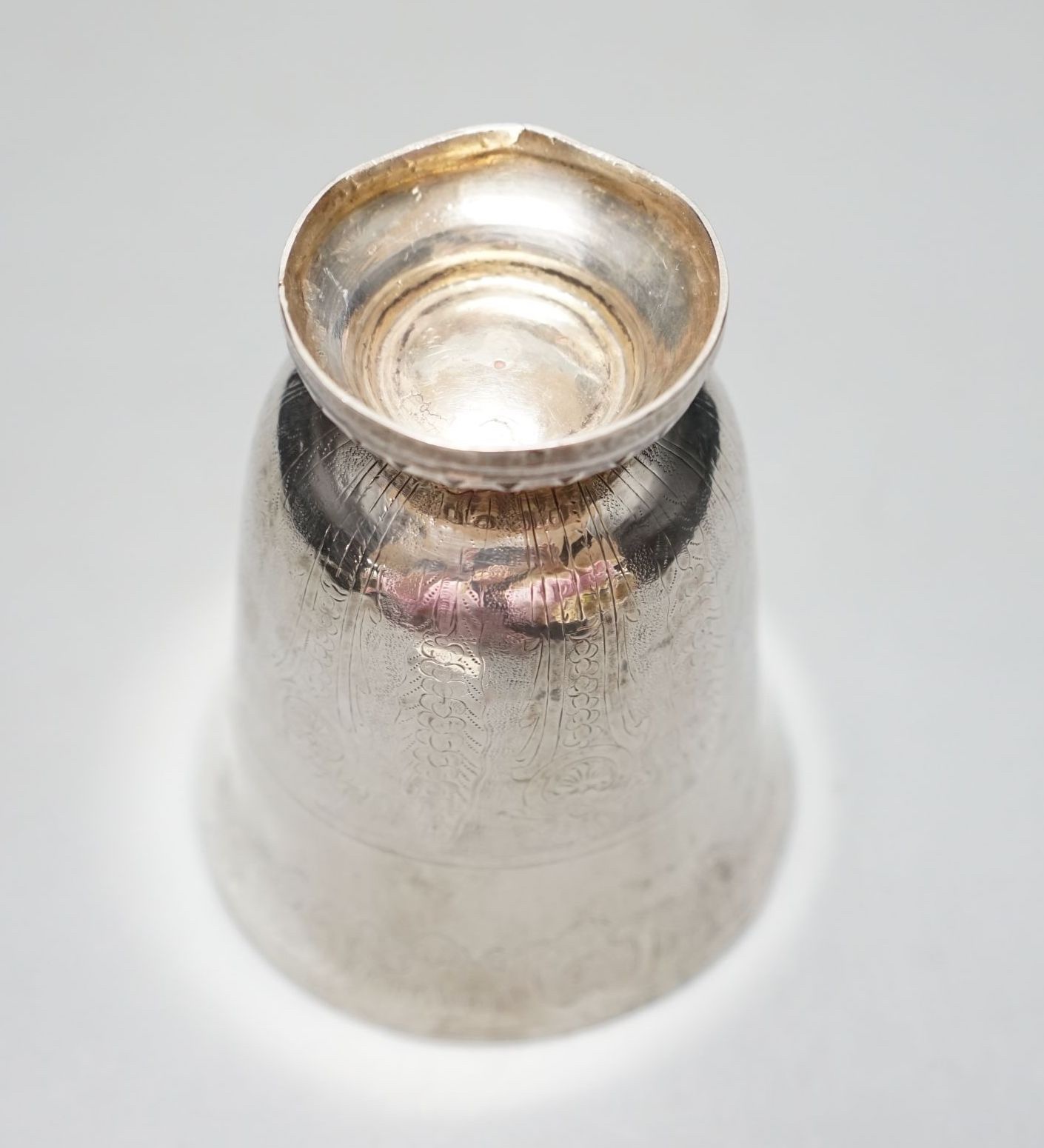 A 19th century French or Swiss engraved white metal beaker, 97mm, 90 grams.